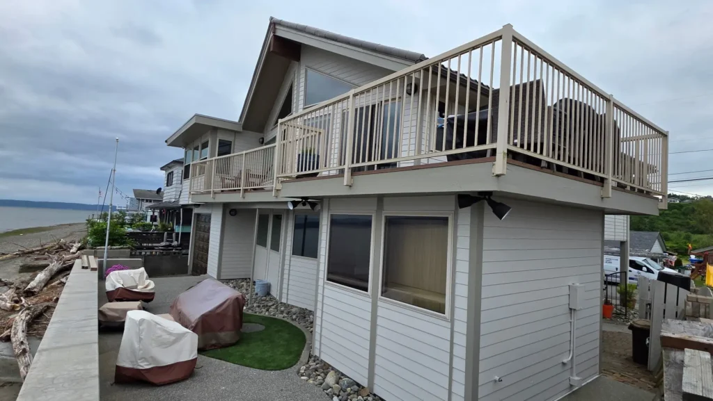 Full Exterior House Painting for a Waterfront Beach Home Freshly painted multi-level home exterior