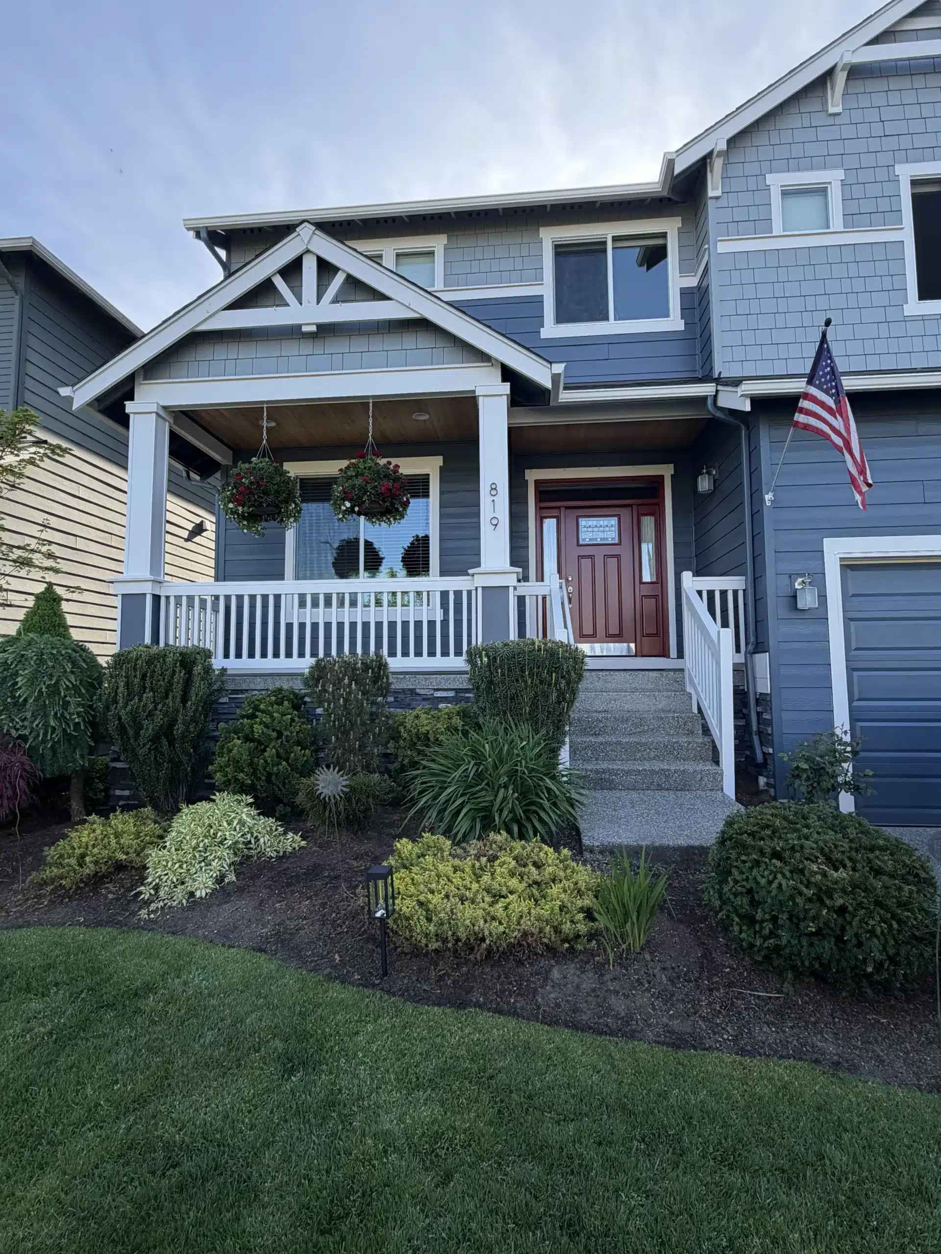 Blue House Exterior Painting with Red Door and White Trim best paint for gutters and fascia