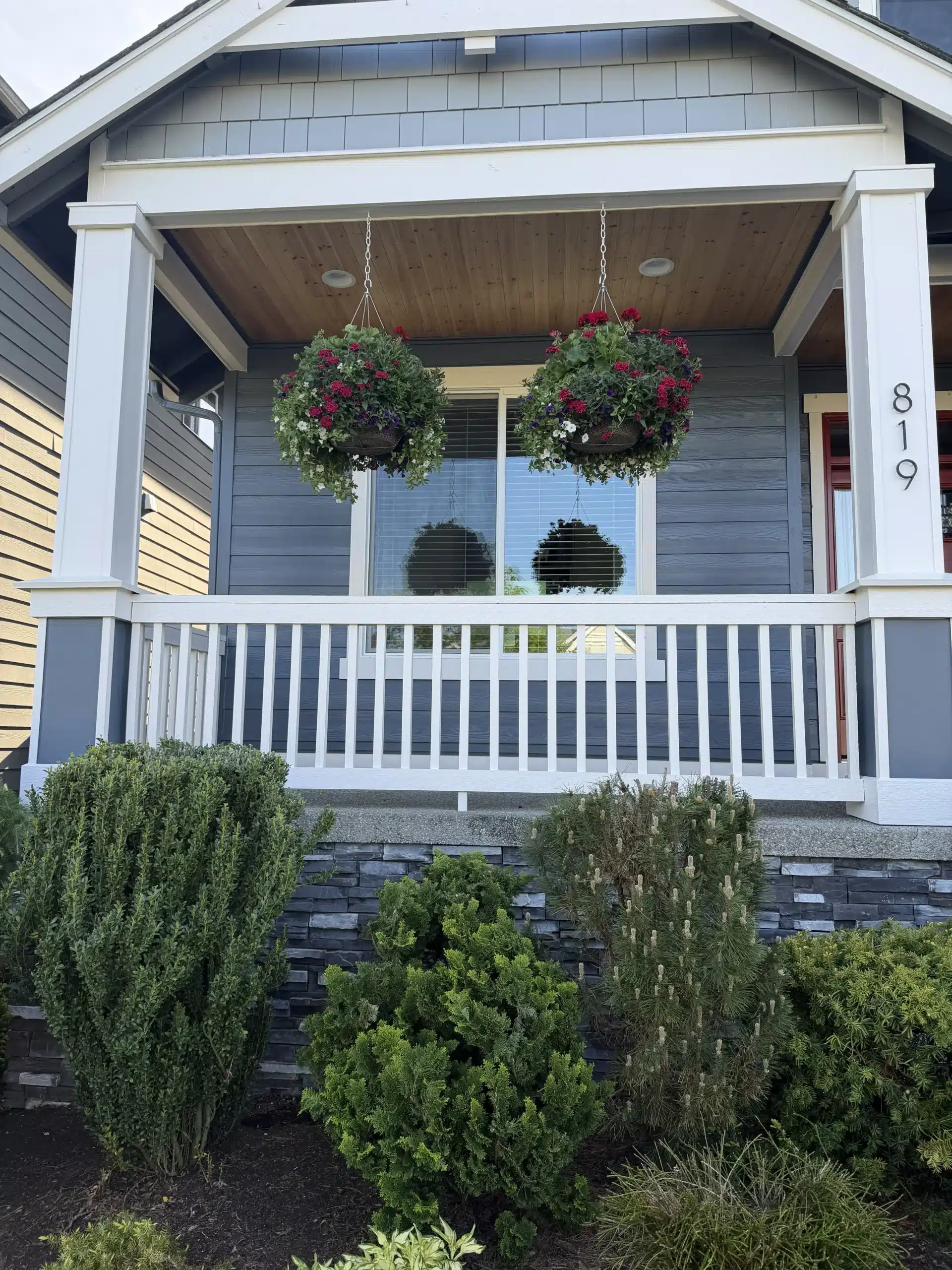 Welcoming Front Porch Painting with White Columns and Dark Siding porch paint colors